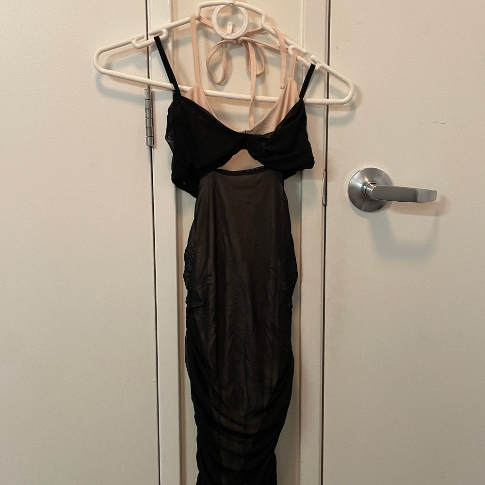 Ruched black and nude dress.